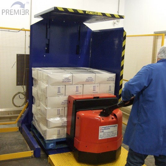 Compact Pallet Inverter being loaded with a pallet of goods